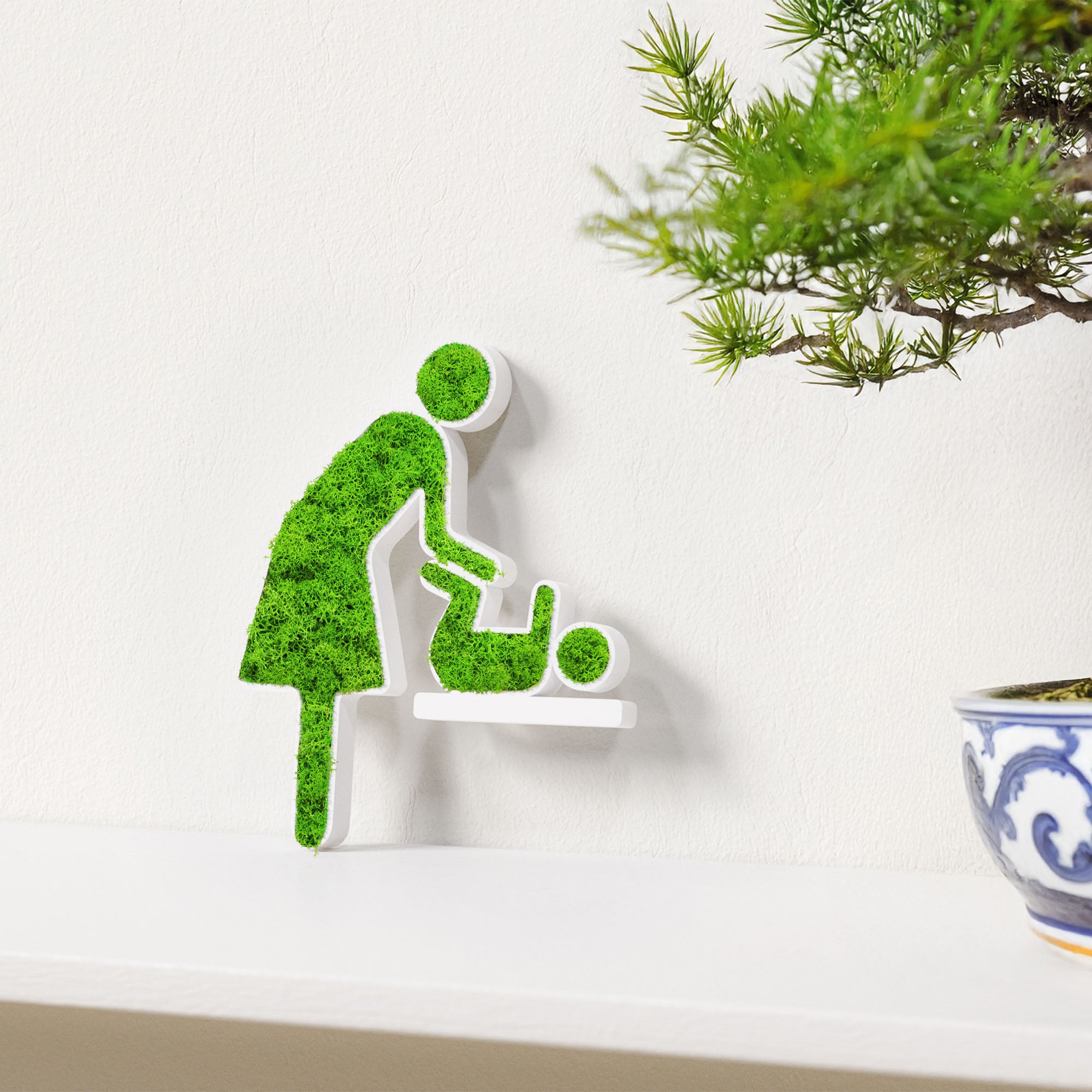 MOOSWERK Moss Door Sign Changing Room Pictogram (Woman & Baby) – Handmade sign with real moss in a white frame