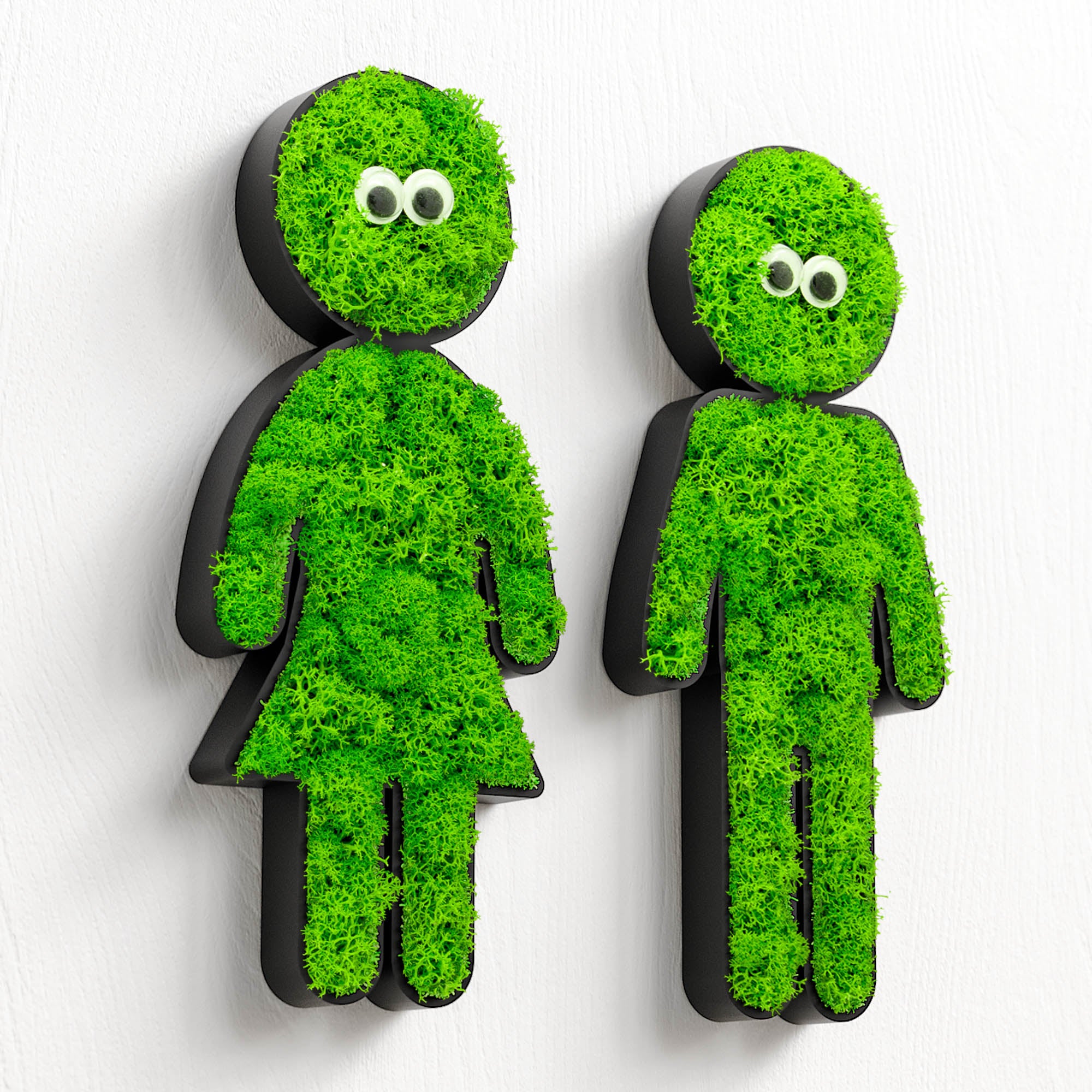 MOOSWERK Moosfigur mit leuchtenden Augen "Glow-Buddy" | Modernes Piktogramm Schwarz aus Islandmoos | Witzige Wanddeko für Flur, WC & Toilette